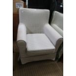 A silver & white gingham covered arm chair