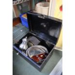 A deed box containing a pair of silver plate serving dishes, a tie press, mantel clock etc