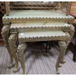 A nest of three brass and onyx occasional tables, and a gilt framed triple dressing table mirror