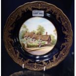 A hand painted Royal Worcester plate depicting Anne Hathaways cottage
