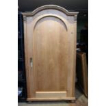 A pine single door armoire
