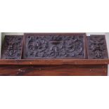 Three carved wood panels