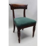 A 19th century mahogany single chair with scrolling flower head carved crest rail with overstuffed s
