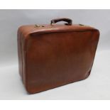 A "Gucci" tan leather suitcase, brass catches, fitted luggage label