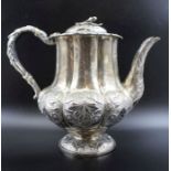 A George IV silver teapot, fluted baluster form