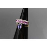 A 9ct white gold ring set seven pink sapphires, ring size: M1/2, together with a teardrop shaped tan