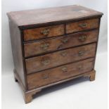 An 18th century yew wood chest of drawers,