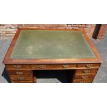 A 19th Century mahogany twin pedestal desk fitted 9 drawers with brass handles. The top is inset wit