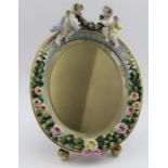 An early 20th century Continental porcelain framed easel mirror