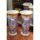 A pair of Noritake porcelain lustre vases floral decorated with butterflies