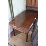 A mid-century teak coffee table with slatted undertier