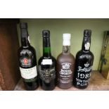 Four bottles of port various