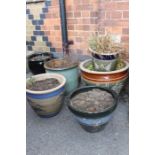Five various incised decorative garden pots