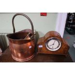 A walnut cased mantel clock, a copper coal scuttle with companion set