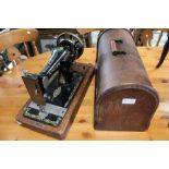 An oak cased Singer sewing machine