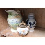 A Crown Devon musical jug, German flagon and a Jap