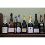 A shelf full of sparkling wines various