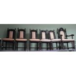 A set of seven carved oak dining chairs, with upholstered back and seat pads, six singles one carver