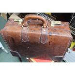 A leather briefcase with combination lock (186)