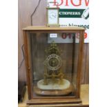 A skeleton clock in case & brass carriage clock