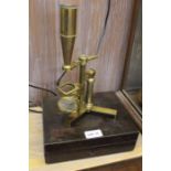A 19th century brass travelling microscope with remains of original box