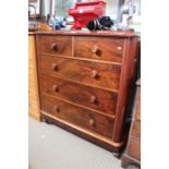 A Victorian mahogany large proportioned five drawer chest, on plinth base with turned bun feet below