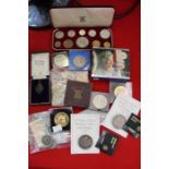 A box of collectors coins & tokens
