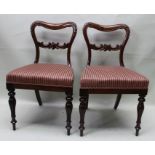 A set of four william IV Rosewood dinning chairs with calved baloon backed and turned four legs