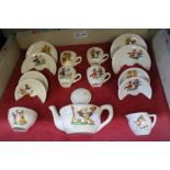 A child's pottery tea set with nursery rhyme decoration in original box