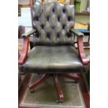 Green studded office swivel chair with wheels