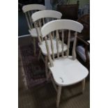 Three later painted spindle back kitchen chairs