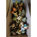 A selection of Hummel Goebel figurines, children mostly with animals, ranging from 8cm to 15cm