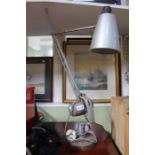 A mid century weighted adjustable task lamp