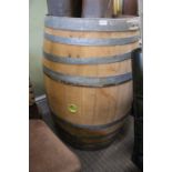 A large French oak wine barrel with galvanised banding