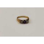 An 18ct gold diamond & amethyst set ring