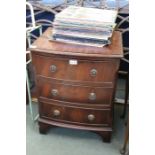 A small reproduction three drawer mahogany chest