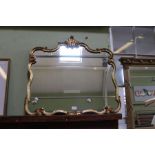 A modern fancy gilt framed plain plate wall mirror