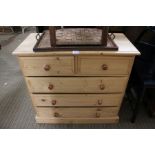 A small modern pine five drawer chest