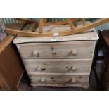 A modern pine chest of three drawers