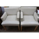 Four cream leather upholstered chairs