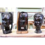 A pair of hardwood African heads plus one other
