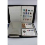 A World stamp album, and an album of first day covers