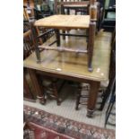 A 20th century oak rectangular topped dining table, on turned and block legs