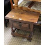 A small wooden stool / coffee table, fitted with a single drawer