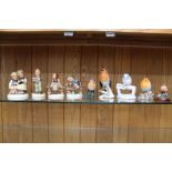 Four hand painted Goebel porcelain child figurines, together with five model birds