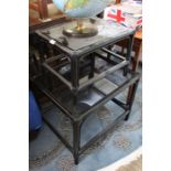Two black finished bamboo framed glass topped coffee tables