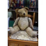 A mid-century articulated teddy bear