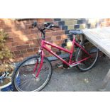 A ladies cerise finished Raleigh off road bicycle