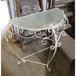 A white painted metal glass topped demi-lune table