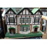 A vintage "Amersham Toys" gabled dolls house, plus contents